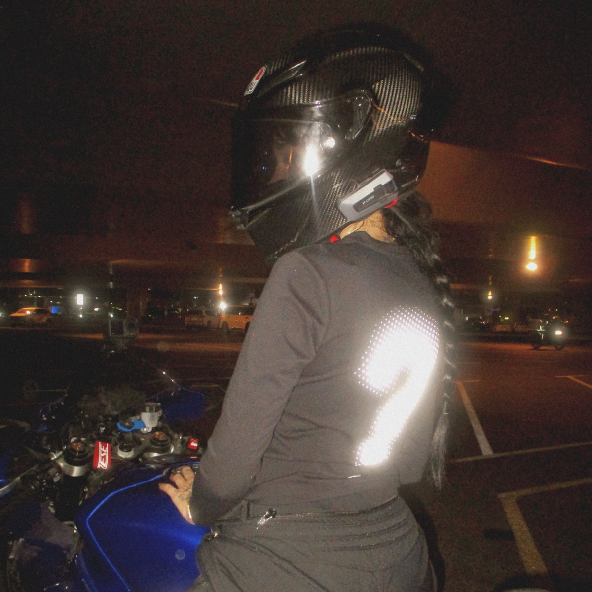 The same CTRL jersey in a car light. The reflective parts look bright white.