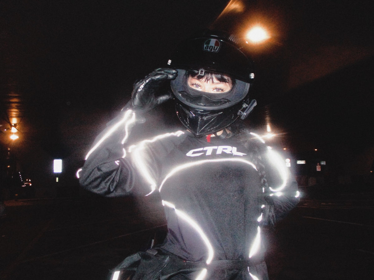 The same CTRL jersey in a car light. The reflective parts look bright white.