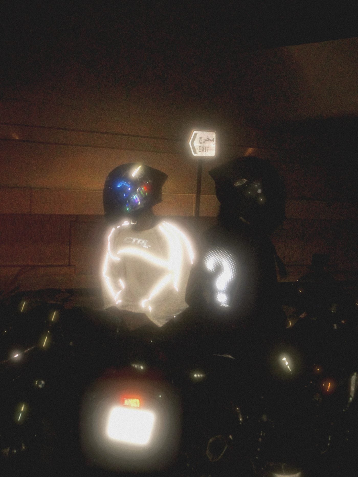Two riders at night in CTRL reflective tops